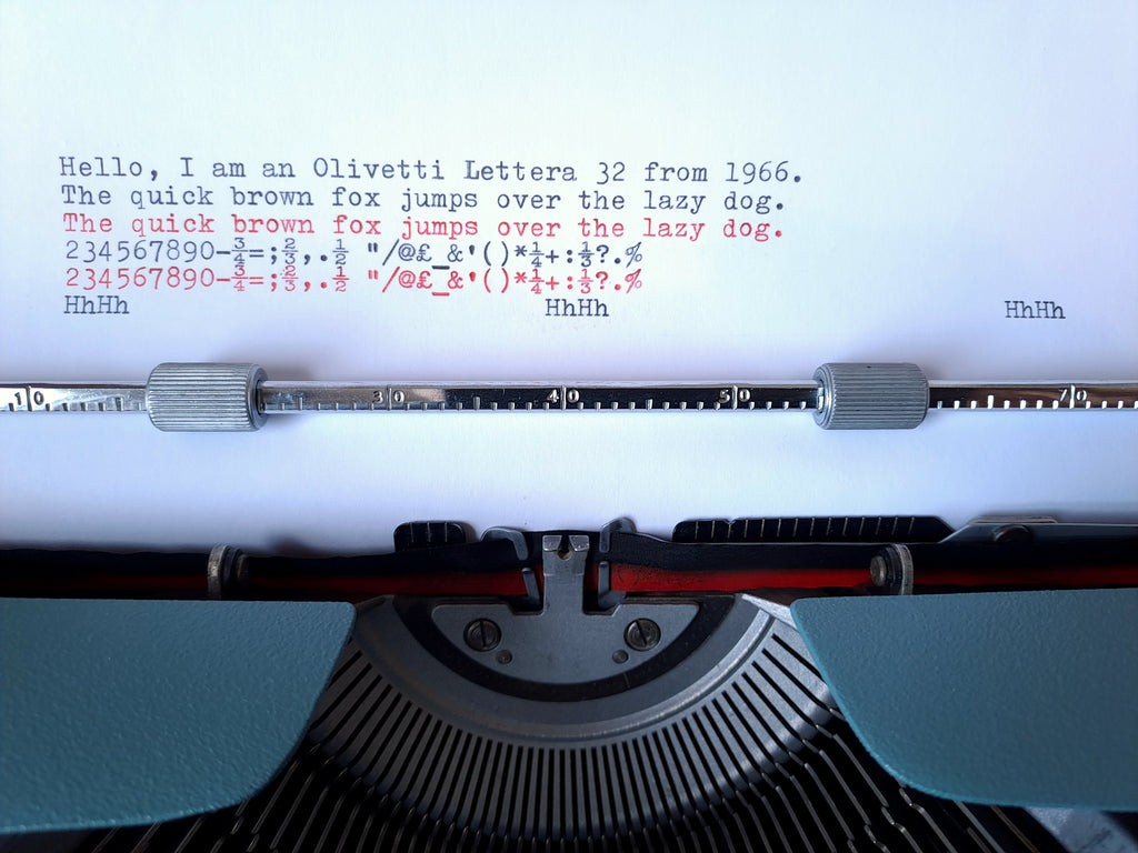 A text sample of a vintage Olivetti Lettera 32 typewriter on a sheet of white paper