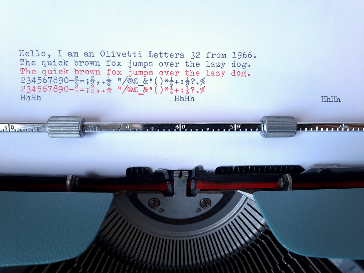 A text sample of a vintage Olivetti Lettera 32 typewriter on a sheet of white paper