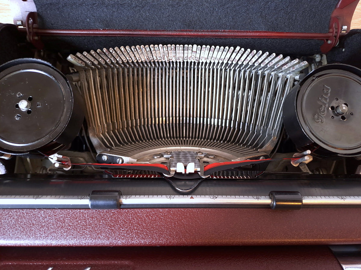 Maroon Olympia SM1 Typewriter