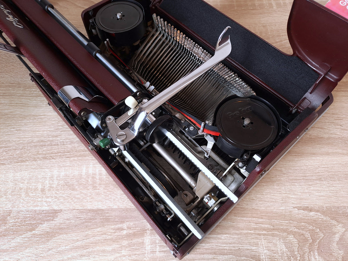 Maroon Olympia SM1 Typewriter