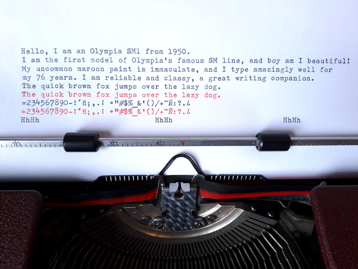 Text sample of a serviced Olympia SM typewriter in dark burgundy red